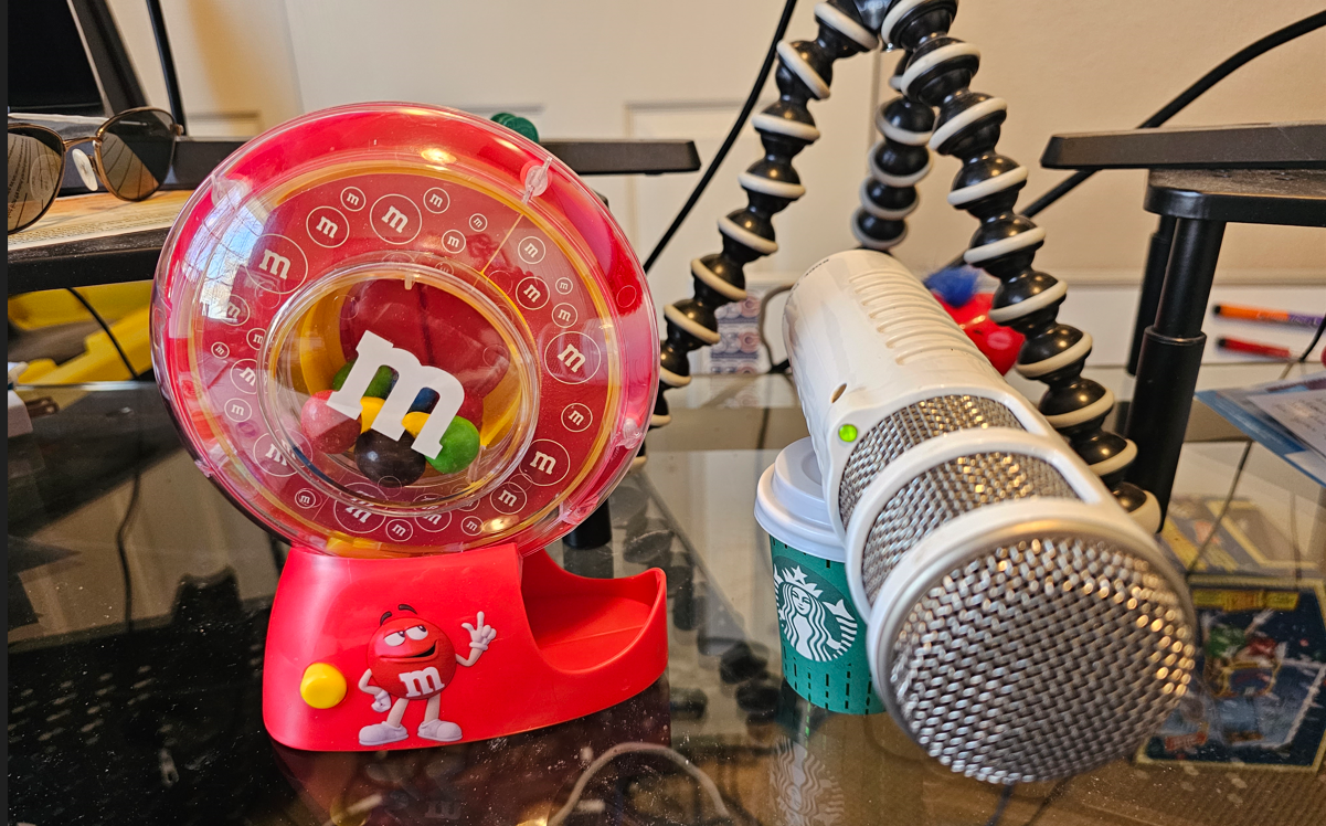 A toy machine and a microphone on a table Description automatically generated