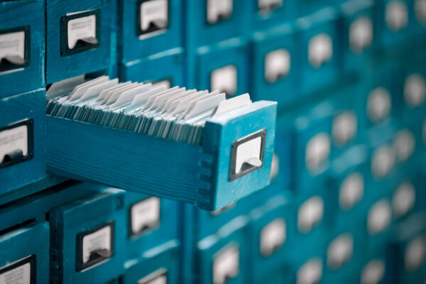 Old-style card catalog drawer, which represents database file structures.